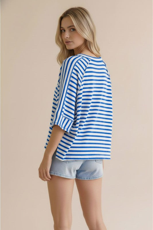 Blue and white striped oversized knit top