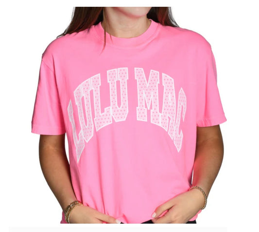 Person wearing a pink t-shirt with 'LITTLE MACK' text on a white background