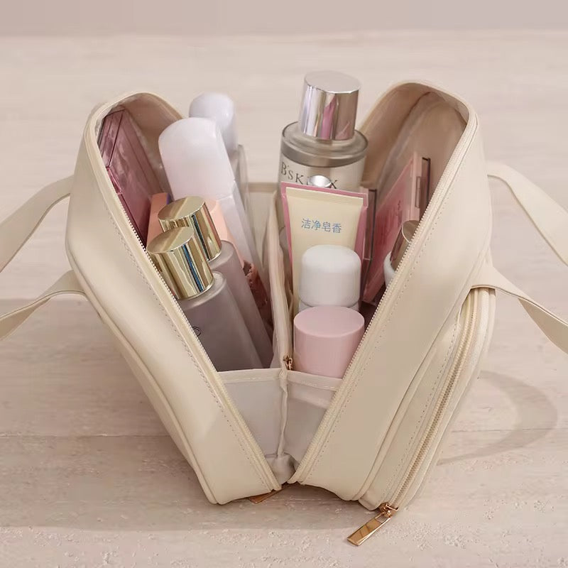 Beige cosmetic bag with various skincare products on a light wooden surface
