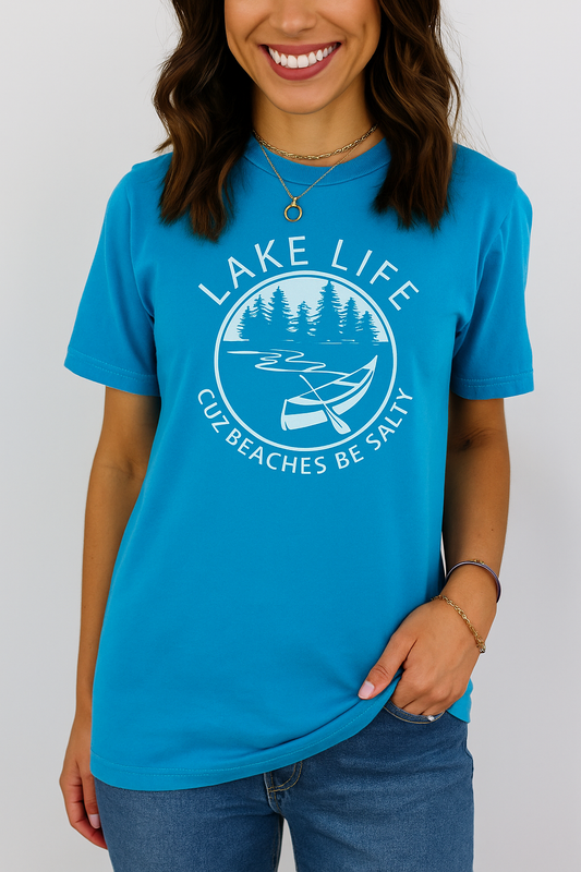 Person wearing a blue 'Lake Life' t-shirt with a graphic design on a white background