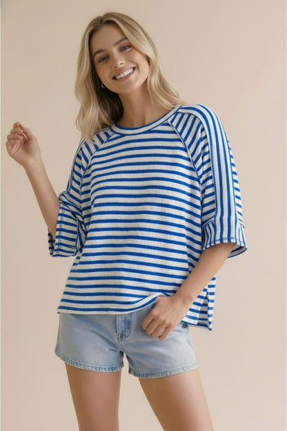 Blue and white striped oversized knit top