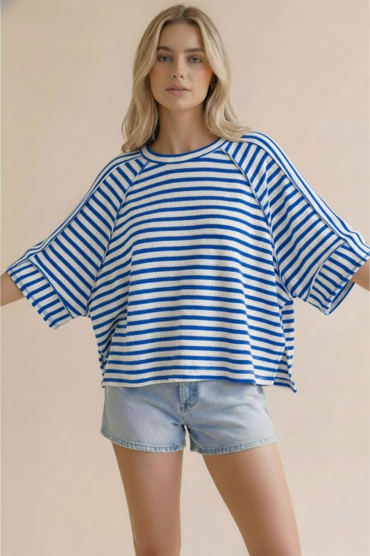Blue and white striped oversized knit top
